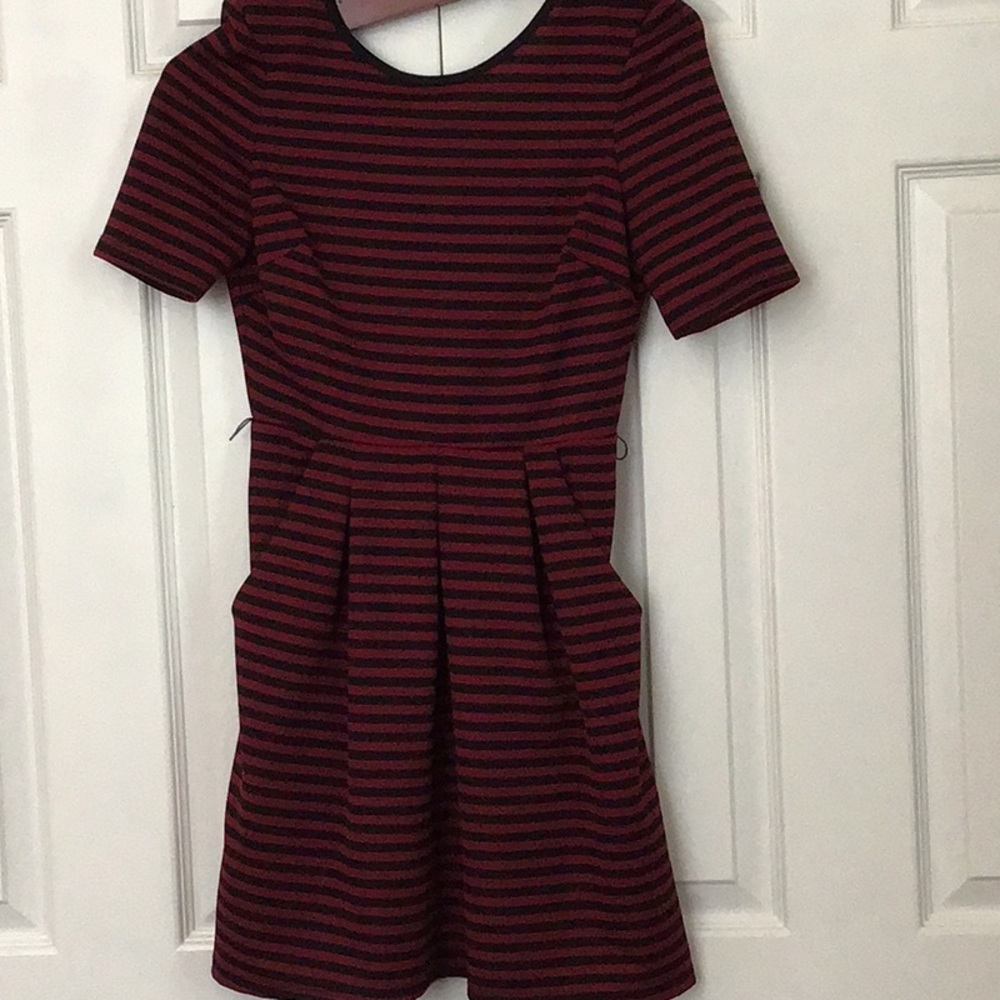 Never worn - missing belt.